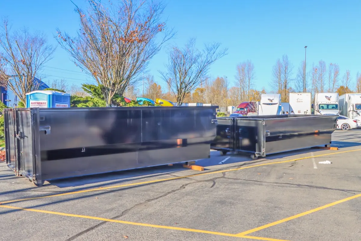 Professional dumpster rental service with roll-off container on residential driveway in Seal Beach